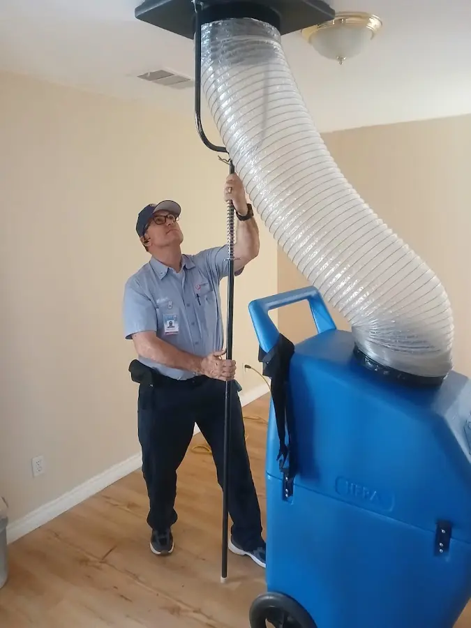 HVAC Installation technician using HEPA equipment in Earl